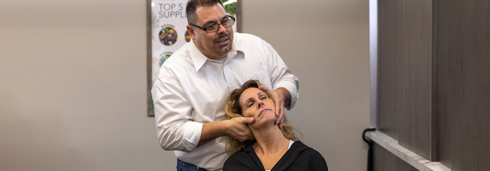 Chiropractor Appleton WI Dan Richter Adjusting Patients Neck