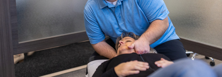 Chiropractor Appleton WI Justin Weyenberg Adjusting Patient