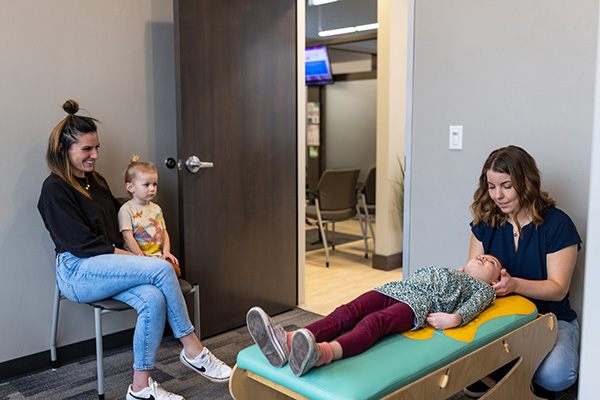 Chiropractor Appleton WI Marissa Moloney Adjusting Young Girl