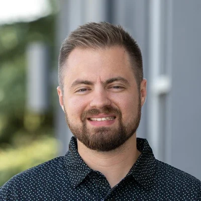 A headshot photo of Dr. Clayton