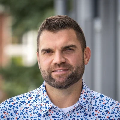 A headshot photo of Dr. Jason