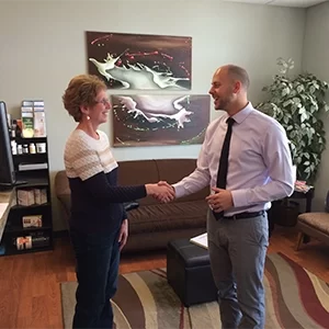 Chiropractor Appleton WI Tyler Skibba with Happy Patient